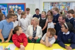 Lia Nici MP (Centre) surrounded by pupils
